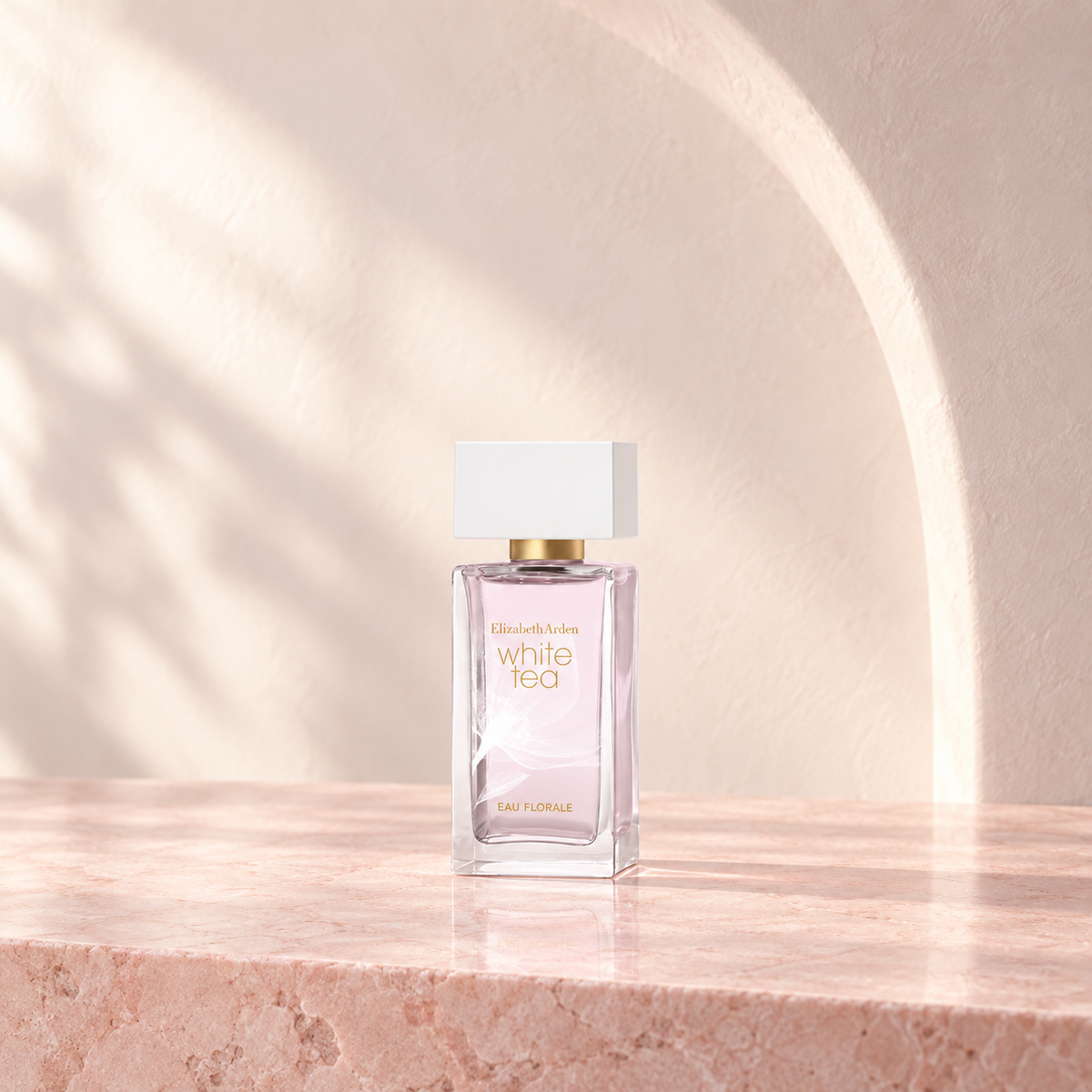 Elizabeth Arden White Tea Eau Florale Eau de Toilette 50ml bottle on a pale-pink stone vanity