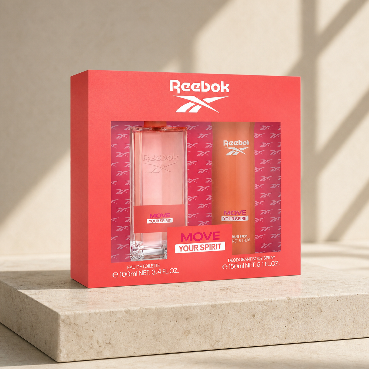 Reebok Move Your Spirit Women Gift Set 100ml EDT and 150ml body spray on a travertine pedestal