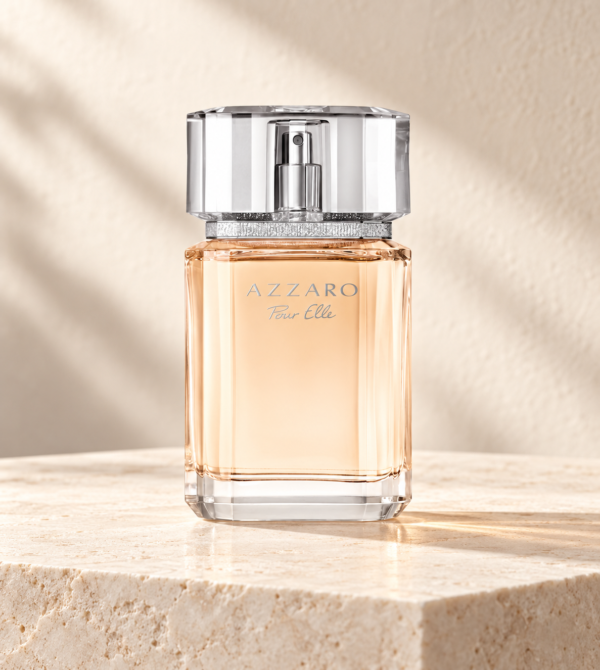 Azzaro Pour Elle Eau de Parfum 100ml bottle on an ivory plinth