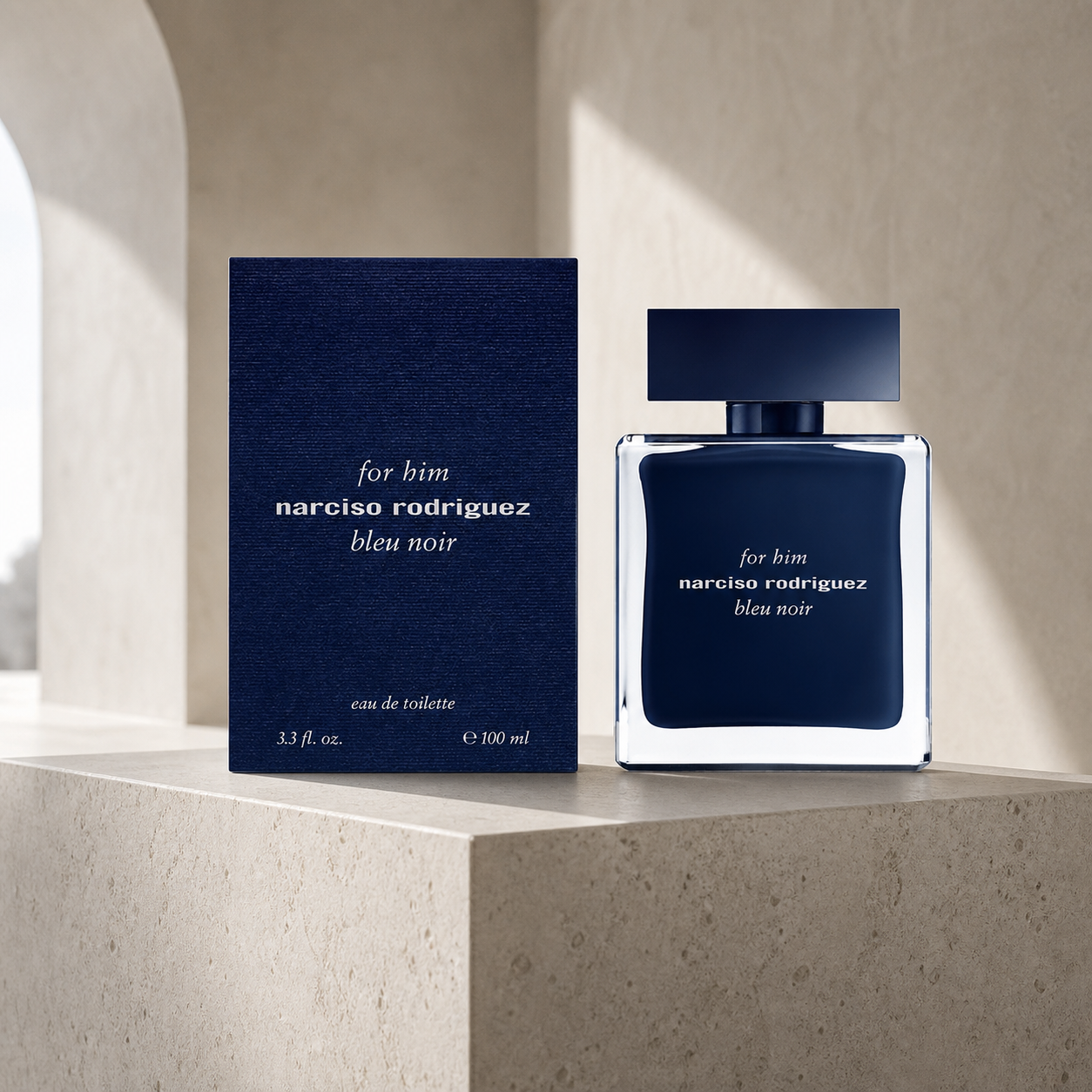 Narciso Rodriguez For Him Bleu Noir Eau de Toilette 100ml bottle and box on a limestone plinth