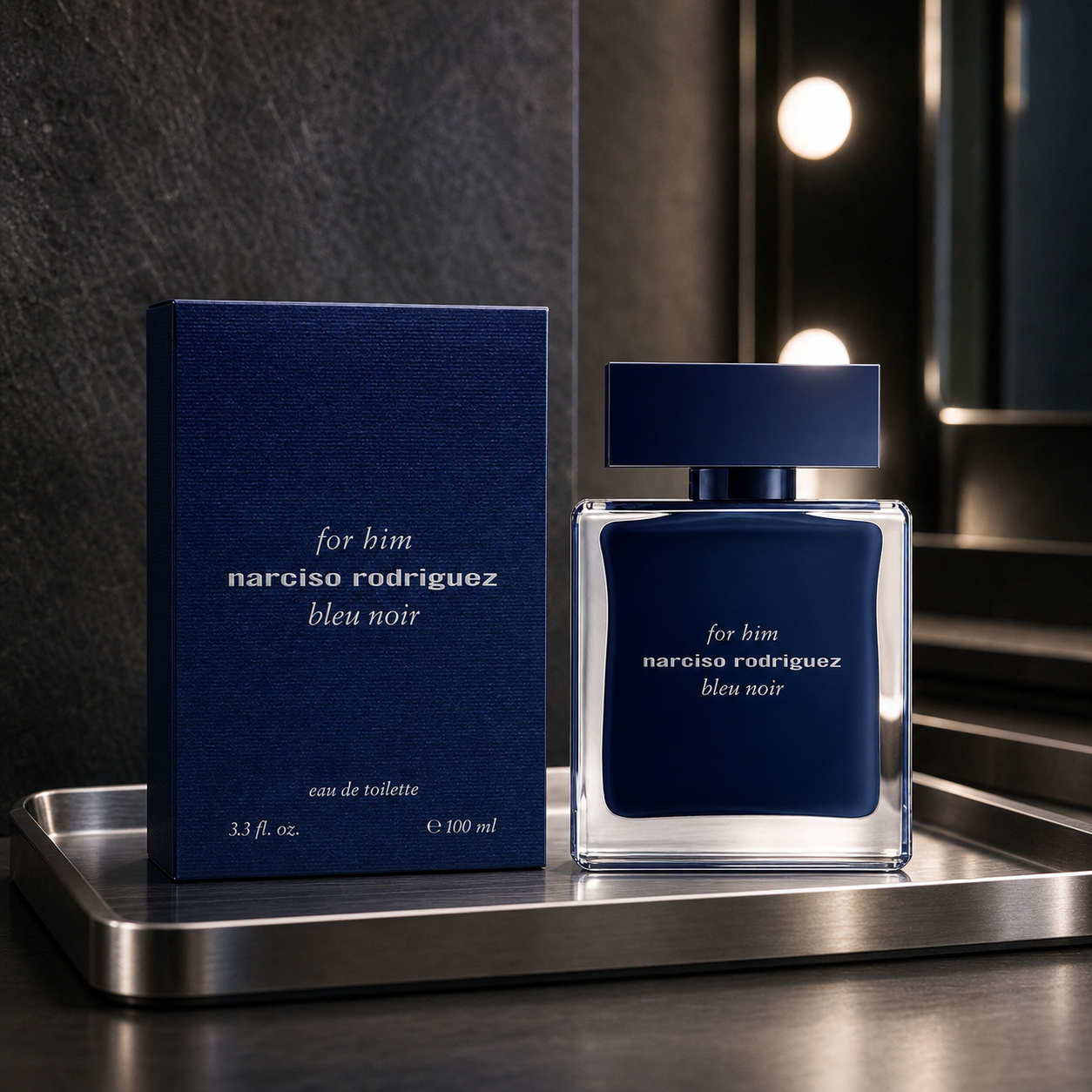 Narciso Rodriguez For Him Bleu Noir Eau de Toilette 100ml bottle and box on a metal tray