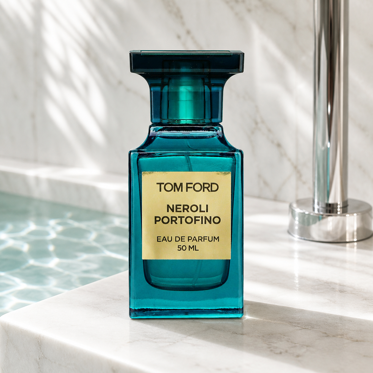 Tom Ford Neroli Portofino Eau de Parfum 50ml bottle beside a stone pool