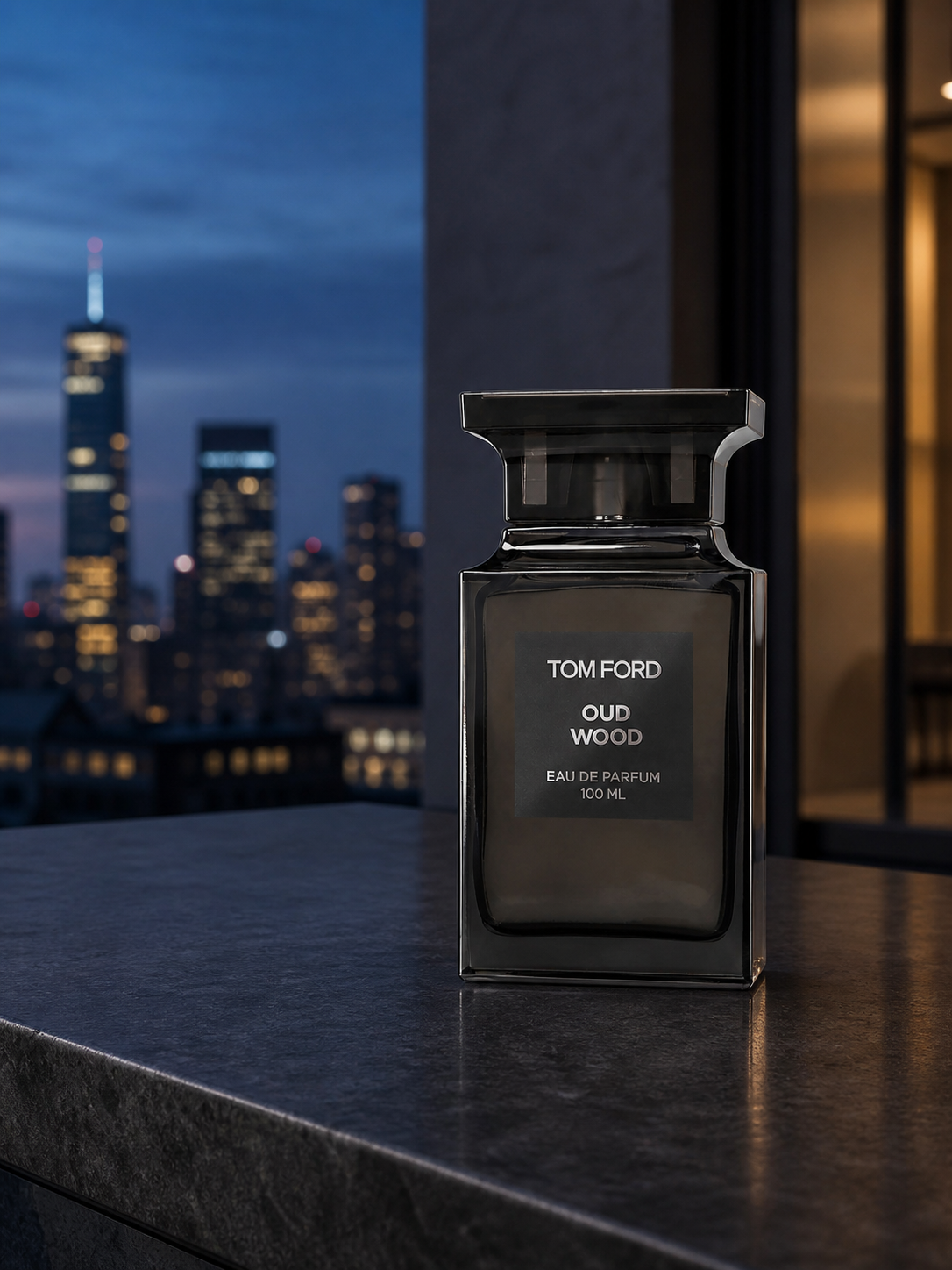 Tom Ford Oud Wood Eau de Parfum 100ml bottle on an urban terrace at dusk