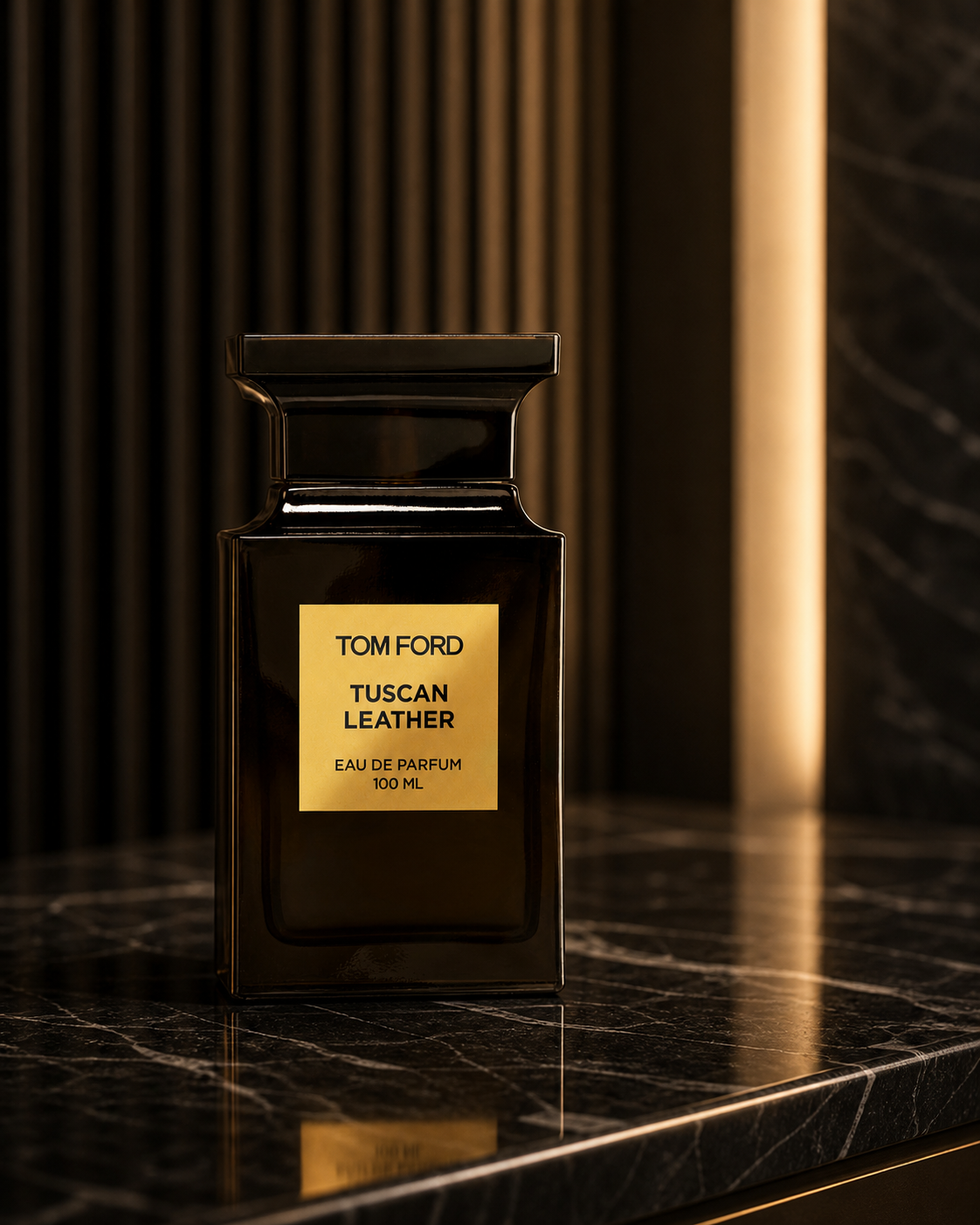 Tom Ford Tuscan Leather Eau de Parfum 100ml bottle on a dark marble console