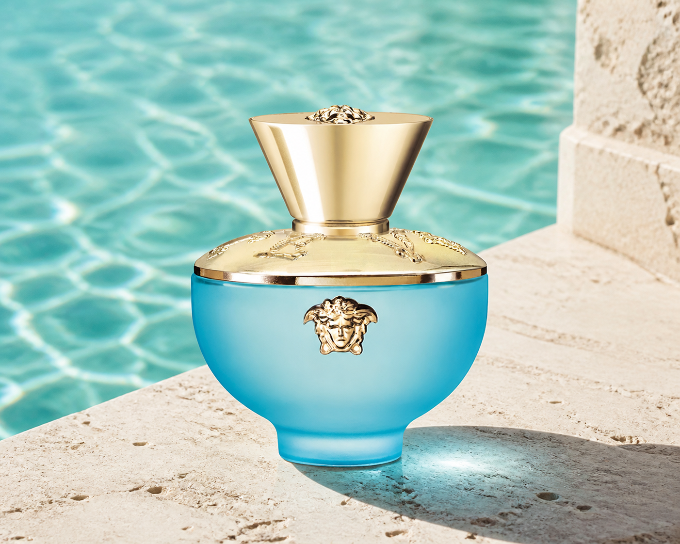 Versace Dylan Turquoise Eau de Toilette 50ml beside turquoise water