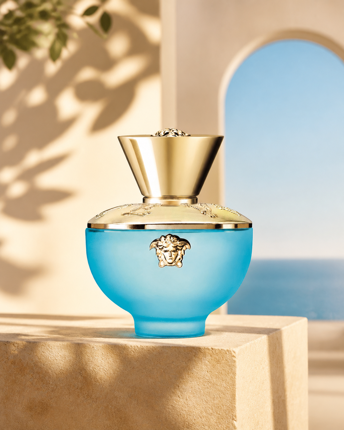 Versace Dylan Turquoise Eau de Toilette 50ml in a warm architectural setting